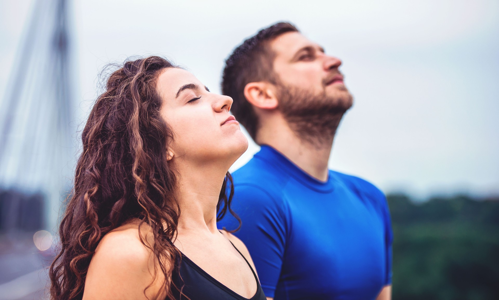 Breath a fresh air. Young couple enjoys together in the morning training outdoor. Sport, fitness, recreation concept